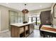 Bright utility room featuring an island, a sink, cabinets for storage, modern washer and dryer, and patterned tile at 2071 Eagle Trace Dr, Greenwood, IN 46143