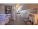 Attic space featuring neutral carpeting, a closet, and a playful ' kitchen set at 401 E Ohio St, Fortville, IN 46040