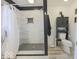 Contemporary bathroom with a walk-in shower, gray tile, and modern fixtures at 401 E Ohio St, Fortville, IN 46040