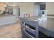 Bright dining room with modern table and chairs next to the kitchen at 401 E Ohio St, Fortville, IN 46040