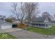 Charming home with a covered porch, detached garage and long driveway, offering both curb appeal and convenience at 401 E Ohio St, Fortville, IN 46040