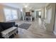 Inviting living room features large windows, neutral colors, and contemporary decor at 401 E Ohio St, Fortville, IN 46040