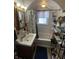 Bathroom with a neutral color scheme, vanity, and tub/shower combo at 504 E Walnut St, Summitville, IN 46070