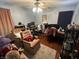 Bedroom featuring computer, desk, ceiling fan, chair, and neutral carpet at 504 E Walnut St, Summitville, IN 46070