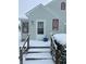 Inviting front entrance of this home with red trim around the windows and door at 504 E Walnut St, Summitville, IN 46070