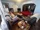 Living room features hardwood floors, area rugs, and comfortable seating at 504 E Walnut St, Summitville, IN 46070