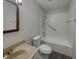 This bathroom features a shower and bath combination with an updated sink and fixtures at 6462 Zionsville Rd, Indianapolis, IN 46268