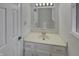 Bright bathroom with a single sink vanity and a large mirror at 6462 Zionsville Rd, Indianapolis, IN 46268