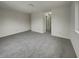 Large, bright bedroom features plush carpeting and access to hallway at 6462 Zionsville Rd, Indianapolis, IN 46268