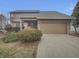 Charming home with a two-car garage, covered porch, and mature landscaping at 6462 Zionsville Rd, Indianapolis, IN 46268