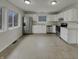 Spacious kitchen with white cabinets, stainless steel appliances, and natural light at 6462 Zionsville Rd, Indianapolis, IN 46268