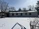 Snowy backyard featuring a pergola and an open view at 720 Mount Rainier Dr, Indianapolis, IN 46217