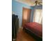 Bright bedroom with hardwood floors, ceiling fan, and a cozy bed near the window at 720 Mount Rainier Dr, Indianapolis, IN 46217