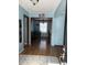 Inviting entryway with hardwood floors leading to a bright dining area at 720 Mount Rainier Dr, Indianapolis, IN 46217