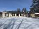 Charming one-story home with a brick facade, attached garage, and snow covered front yard at 720 Mount Rainier Dr, Indianapolis, IN 46217