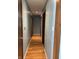 Hallway featuring hardwood floors connecting various rooms at 720 Mount Rainier Dr, Indianapolis, IN 46217