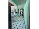 Galley kitchen with modern appliances and black and white patterned floors at 720 Mount Rainier Dr, Indianapolis, IN 46217