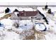 Aerial view of the home shows yard with pool, patio and vintage windmill at 7705 N State Road 42, Stilesville, IN 46180