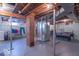 Unfinished basement featuring exposed brick accents, and laundry area, ready for transformation at 7705 N State Road 42, Stilesville, IN 46180