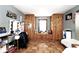 Bedroom featuring hardwood floors, built-in closets, and a window seat at 7705 N State Road 42, Stilesville, IN 46180