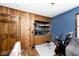 Bedroom with recording studio elements, wood paneling, and space for creative pursuits at 7705 N State Road 42, Stilesville, IN 46180
