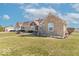 Attractive ranch home boasts mature trees, a basketball hoop, and a serene country setting at 7705 N State Road 42, Stilesville, IN 46180