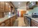 The kitchen offers plenty of cabinet space and stainless steel appliances for an excellent cooking experience at 7705 N State Road 42, Stilesville, IN 46180