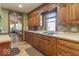 Lovely kitchen featuring warm wood cabinetry, ample counter space, and a tile backsplash at 7705 N State Road 42, Stilesville, IN 46180