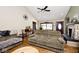 Bright living room with vaulted ceilings, a fireplace, wood floors, and neutral colored walls at 7705 N State Road 42, Stilesville, IN 46180