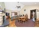 Open concept living and dining rooms with a fireplace, and vaulted ceilings at 7705 N State Road 42, Stilesville, IN 46180
