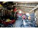 Interior shot of the shed shows tractors, mower, and supplies at 7705 N State Road 42, Stilesville, IN 46180