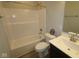 Well-lit bathroom showcases a shower-tub combination, white vanity, and matching toilet at 10502 Oak Bend Blvd, Indianapolis, IN 46239