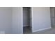 Carpeted bedroom features a walk-in closet and a connecting door to a private bathroom at 10502 Oak Bend Blvd, Indianapolis, IN 46239
