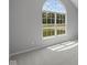 Bedroom boasts a vaulted ceiling with a unique arched window providing lots of light at 10502 Oak Bend Blvd, Indianapolis, IN 46239