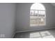 Bright bedroom with large window, plush carpeting, and neutral color palette at 10502 Oak Bend Blvd, Indianapolis, IN 46239