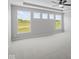 A bright bedroom with large windows overlooking green fields at 10502 Oak Bend Blvd, Indianapolis, IN 46239