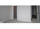Carpeted bedroom with neutral walls and two open doorways at 10502 Oak Bend Blvd, Indianapolis, IN 46239