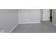 Carpeted bedroom with neutral walls and trim with door to hallway or other room at 10502 Oak Bend Blvd, Indianapolis, IN 46239
