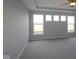 Bedroom with plush carpeting and multiple windows offering natural light and outdoor views at 10502 Oak Bend Blvd, Indianapolis, IN 46239