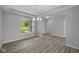 The dining room offers sleek floors and open access to the surrounding living spaces at 10502 Oak Bend Blvd, Indianapolis, IN 46239