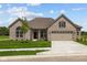 Charming single-story home with a two-car garage and well-manicured lawn at 10502 Oak Bend Blvd, Indianapolis, IN 46239