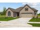 Charming single-story home with a two-car garage and well-manicured lawn at 10502 Oak Bend Blvd, Indianapolis, IN 46239