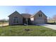 Charming single-story brick home with manicured lawn and inviting curb appeal on a clear day at 10502 Oak Bend Blvd, Indianapolis, IN 46239