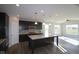 Well-equipped kitchen with an island, modern appliances, stylish cabinetry, and open layout to the living area at 10502 Oak Bend Blvd, Indianapolis, IN 46239