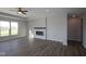 Comfortable living room featuring a modern fireplace, plank flooring, bright windows, and ample space at 10502 Oak Bend Blvd, Indianapolis, IN 46239