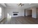 Spacious living room with a modern fireplace, recessed lighting, and beautiful plank flooring for style and comfort at 10502 Oak Bend Blvd, Indianapolis, IN 46239