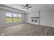 Spacious living room boasts sleek flooring, lots of natural light and modern fireplace feature at 10502 Oak Bend Blvd, Indianapolis, IN 46239