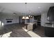 Open-concept living area with modern finishes, seamless flow from kitchen to living room, and plenty of natural light at 10502 Oak Bend Blvd, Indianapolis, IN 46239
