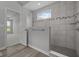 A modern tiled shower space with built-in bench, window and glass partition at 10502 Oak Bend Blvd, Indianapolis, IN 46239