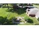 Aerial view of a well-maintained backyard featuring a custom water feature and mature trees at 1231 S Catherwood Ave, Indianapolis, IN 46203
